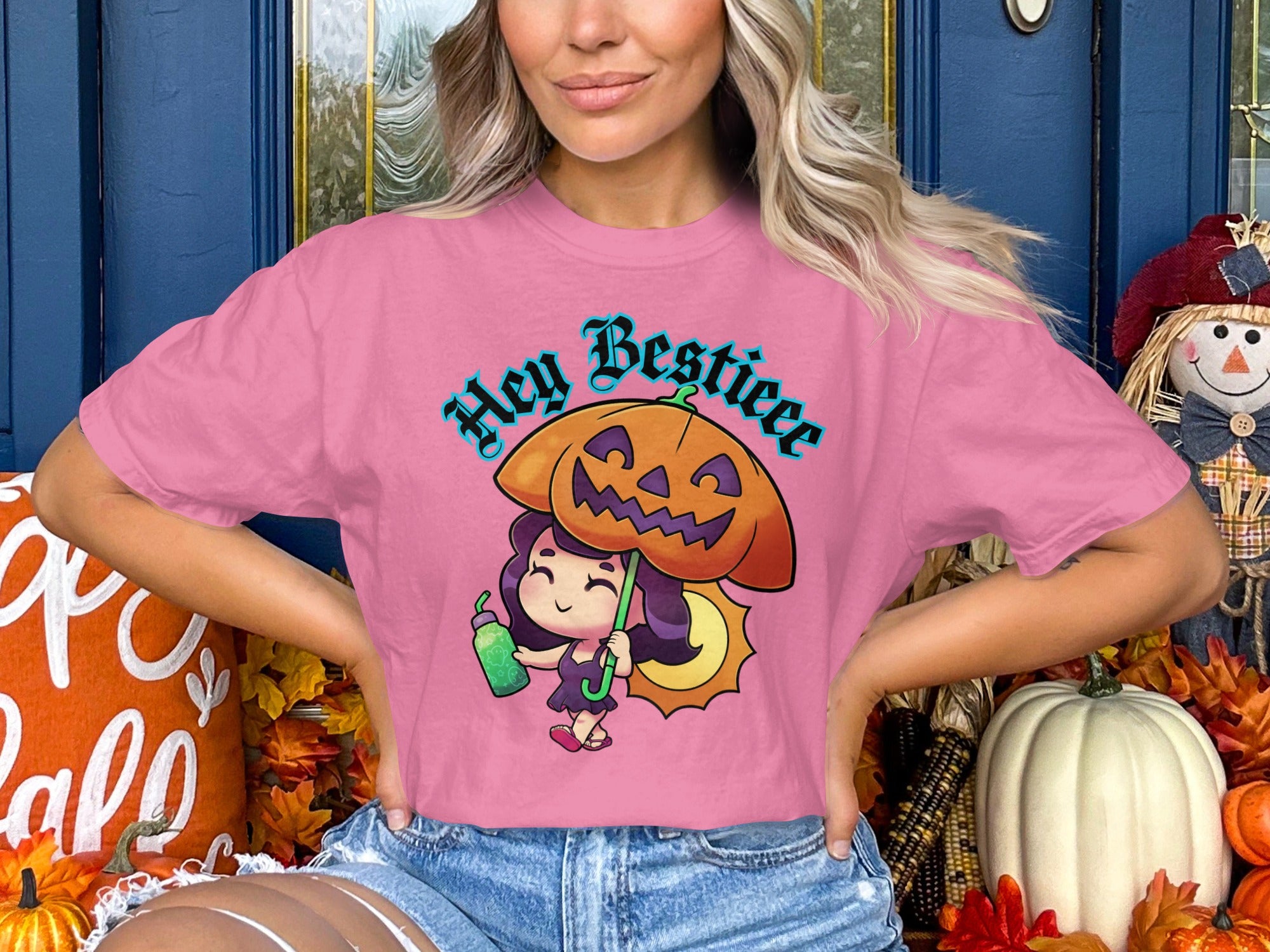 Pink t-shirt with cartoon girl holding pumpkin umbrella and text "Hey Bestiee".