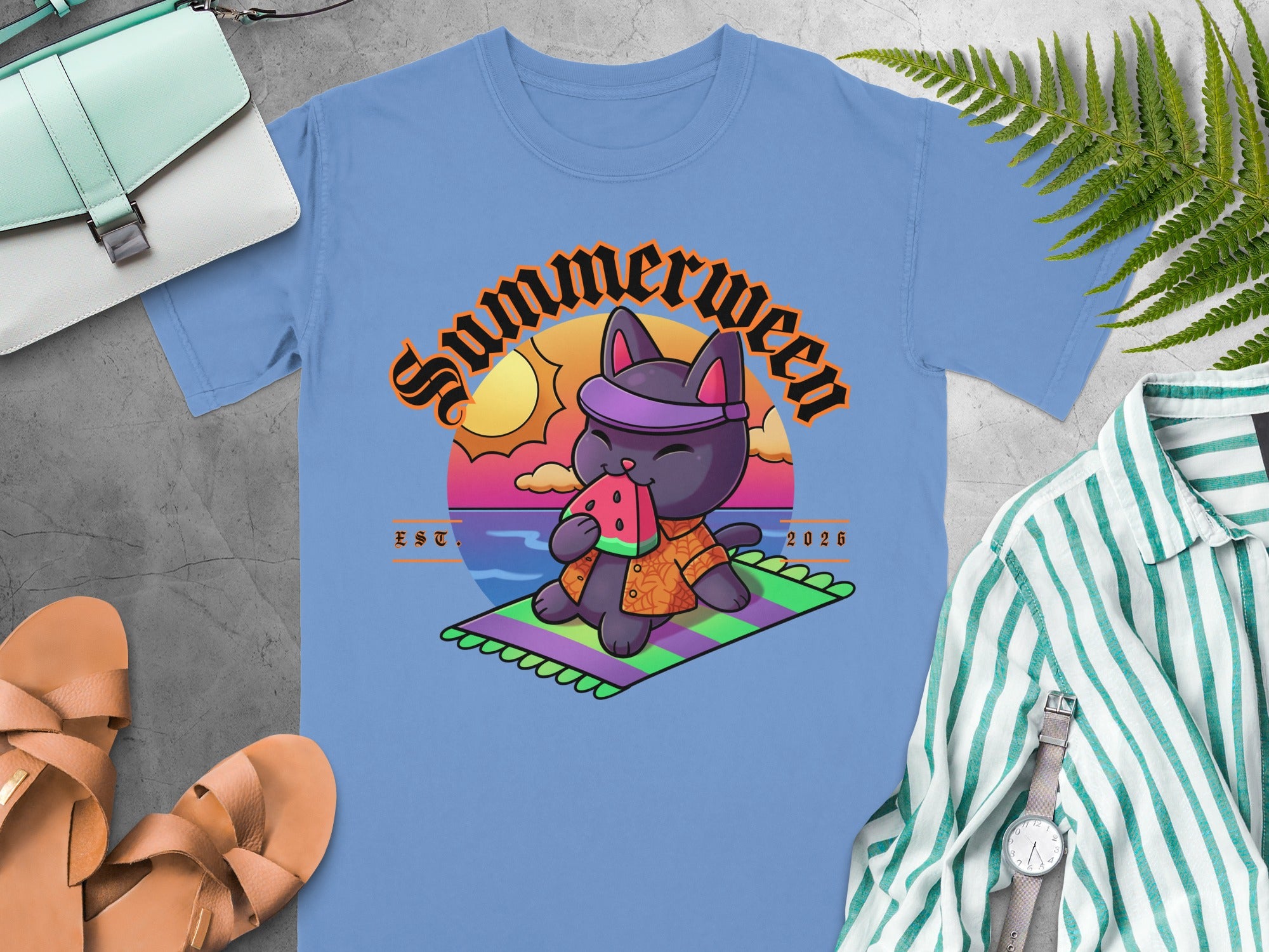 Light blue t-shirt with a cartoon black cat eating watermelon and "Summerween" text.