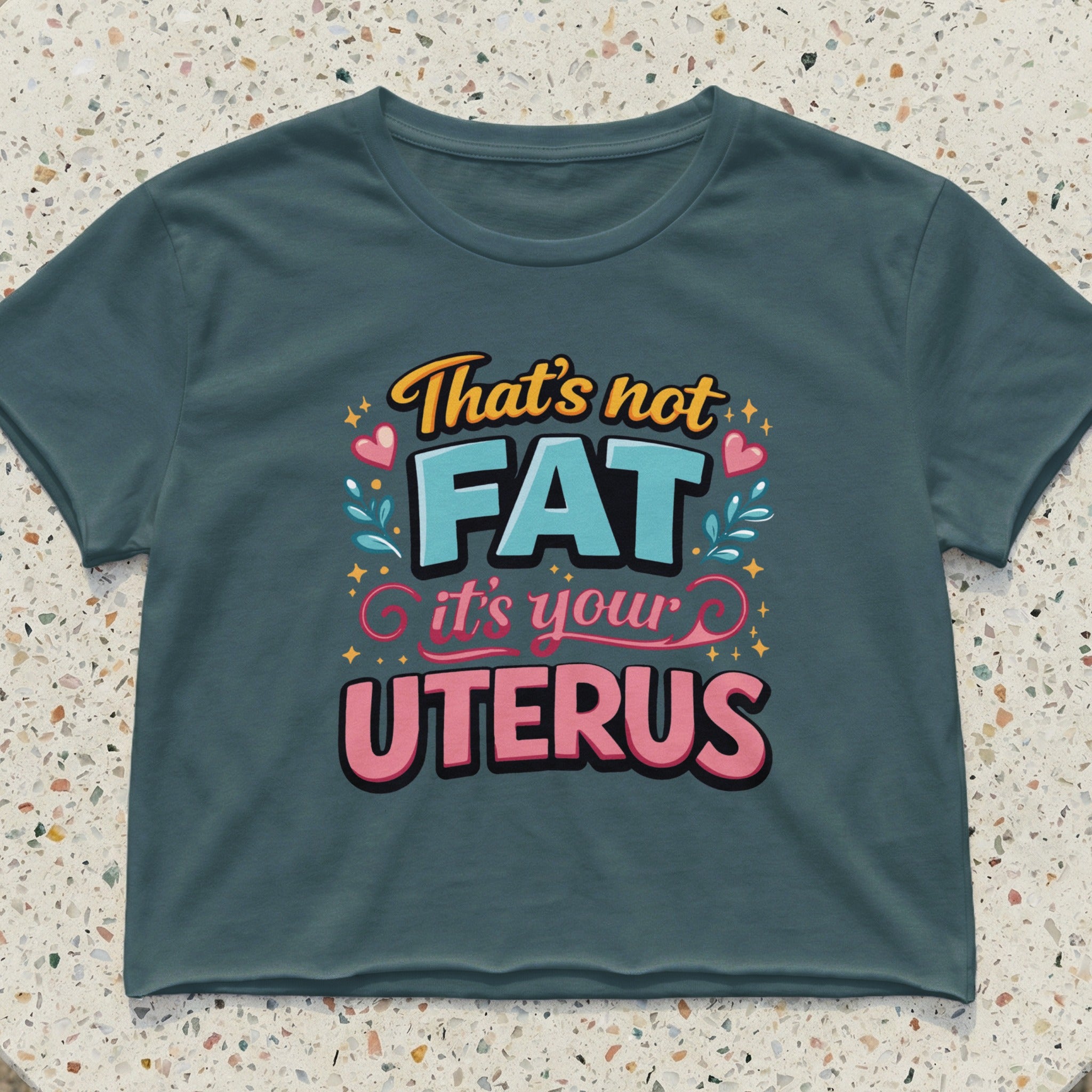 Dark teal crop top with text "That's not FAT it's your UTERUS"