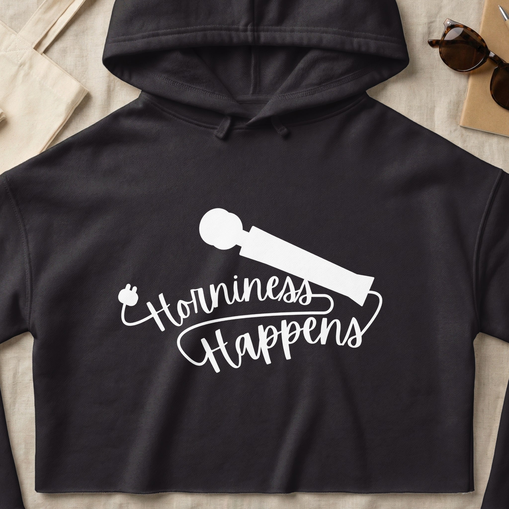 Black hoodie with white text and graphic: "Horniness Happens."