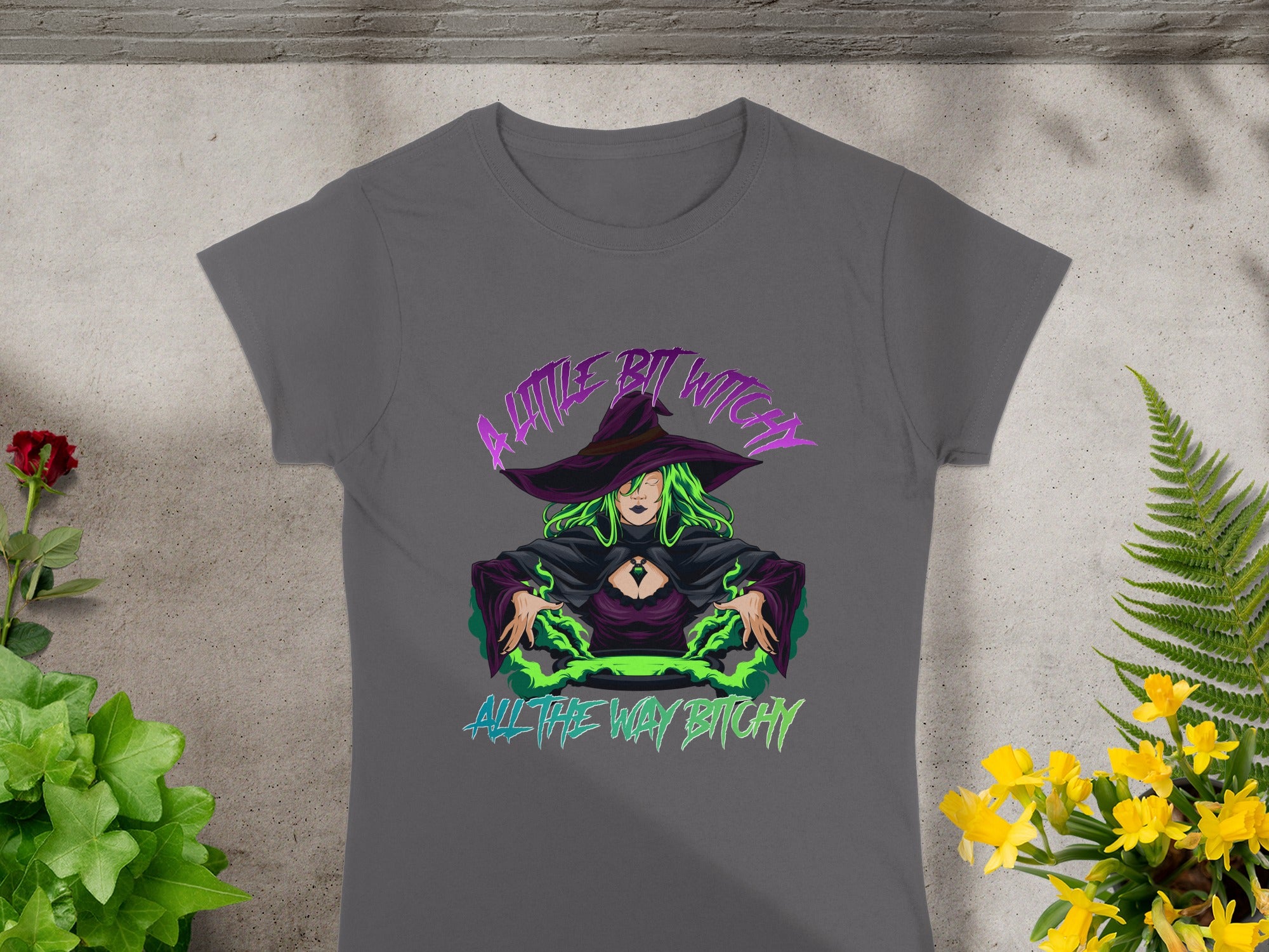 Dark grey t-shirt with witch graphic and "A little bit witchy all the way bitchy" text.