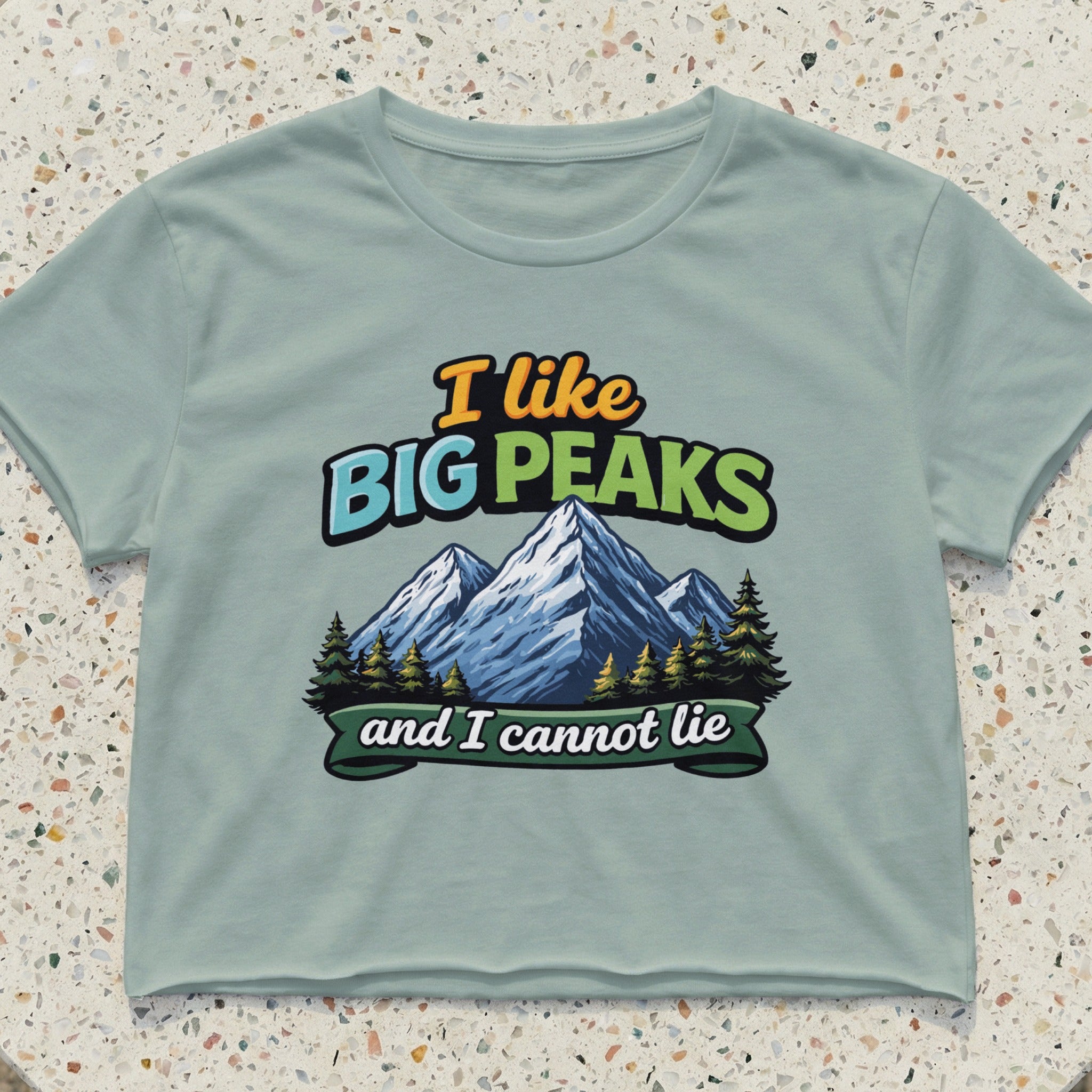 T-shirt with "I like Big Peaks and I cannot lie" text and mountain graphic.