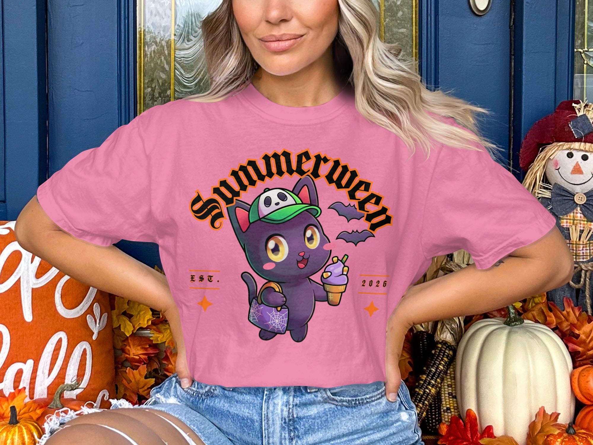 Pink t-shirt with a cartoon cat wearing a hat and holding ice cream, with "Summerween" text.