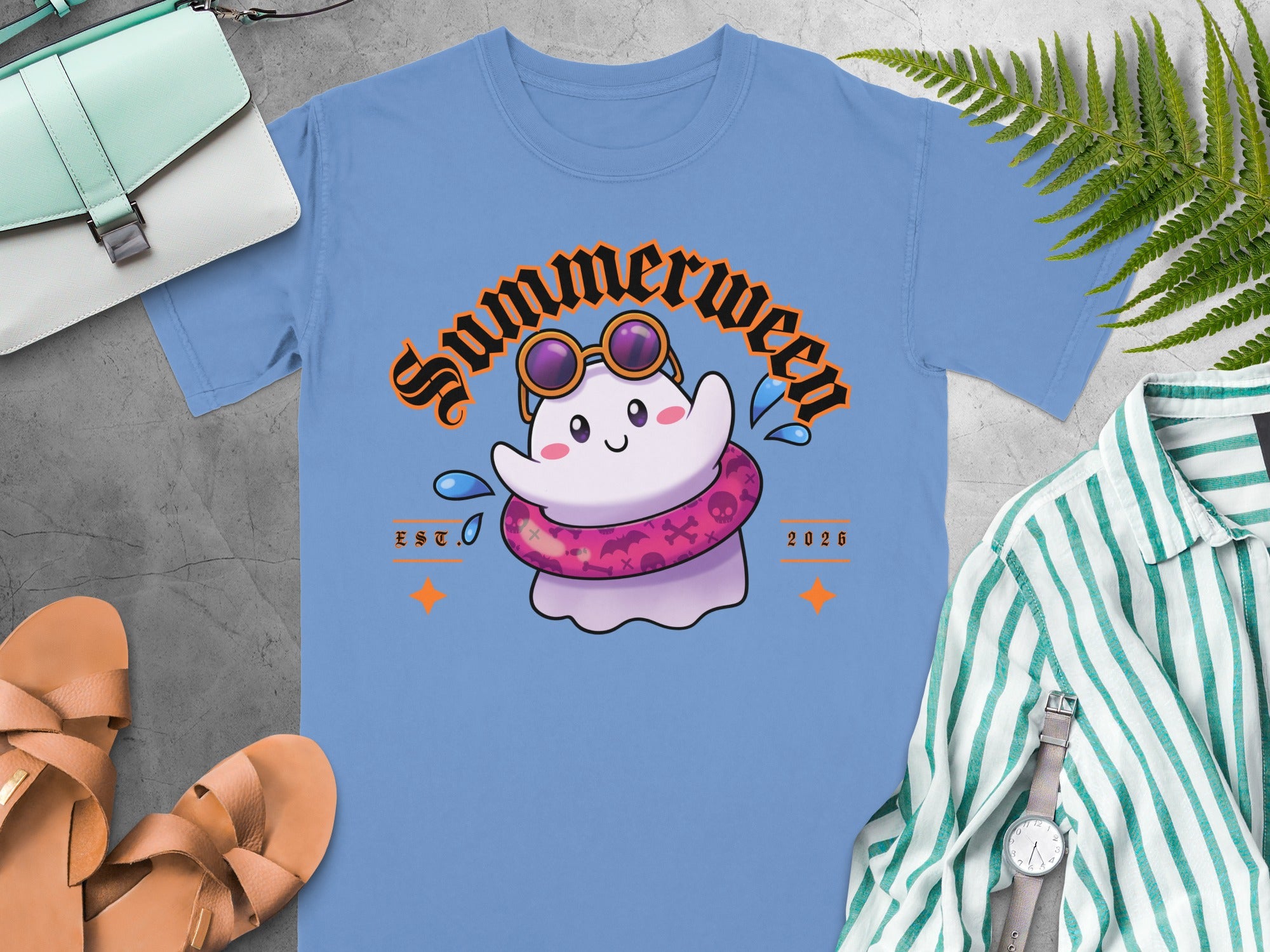 Blue t-shirt with a cute ghost wearing sunglasses and a pink inner tube, "Summerween" text.