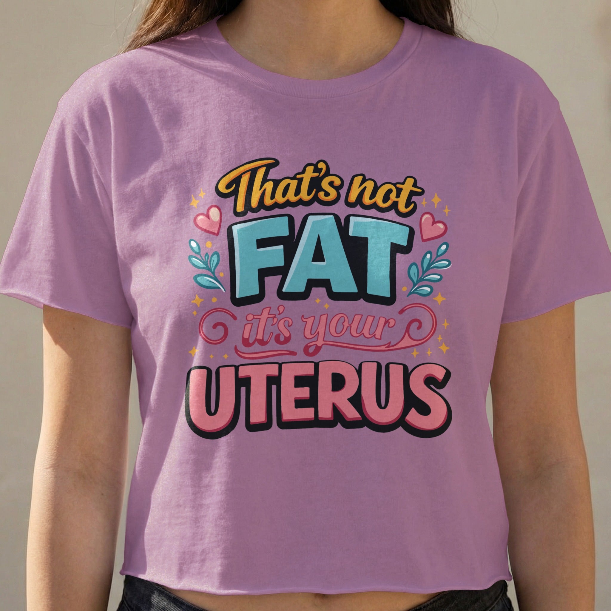 Purple cropped t-shirt with text "That's not FAT it's your UTERUS".