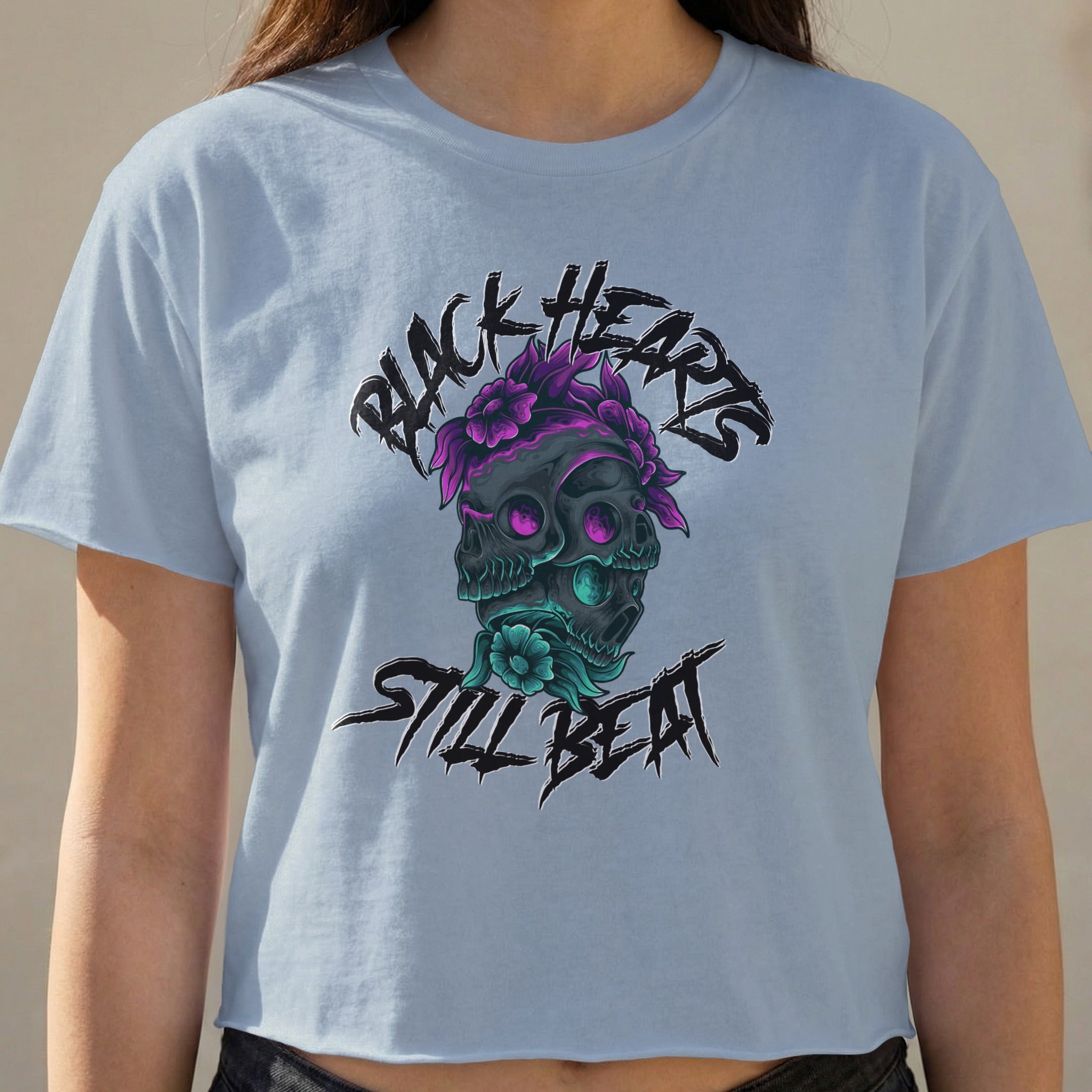 Black Hearts Still Beat graphic on light blue cropped t-shirt.