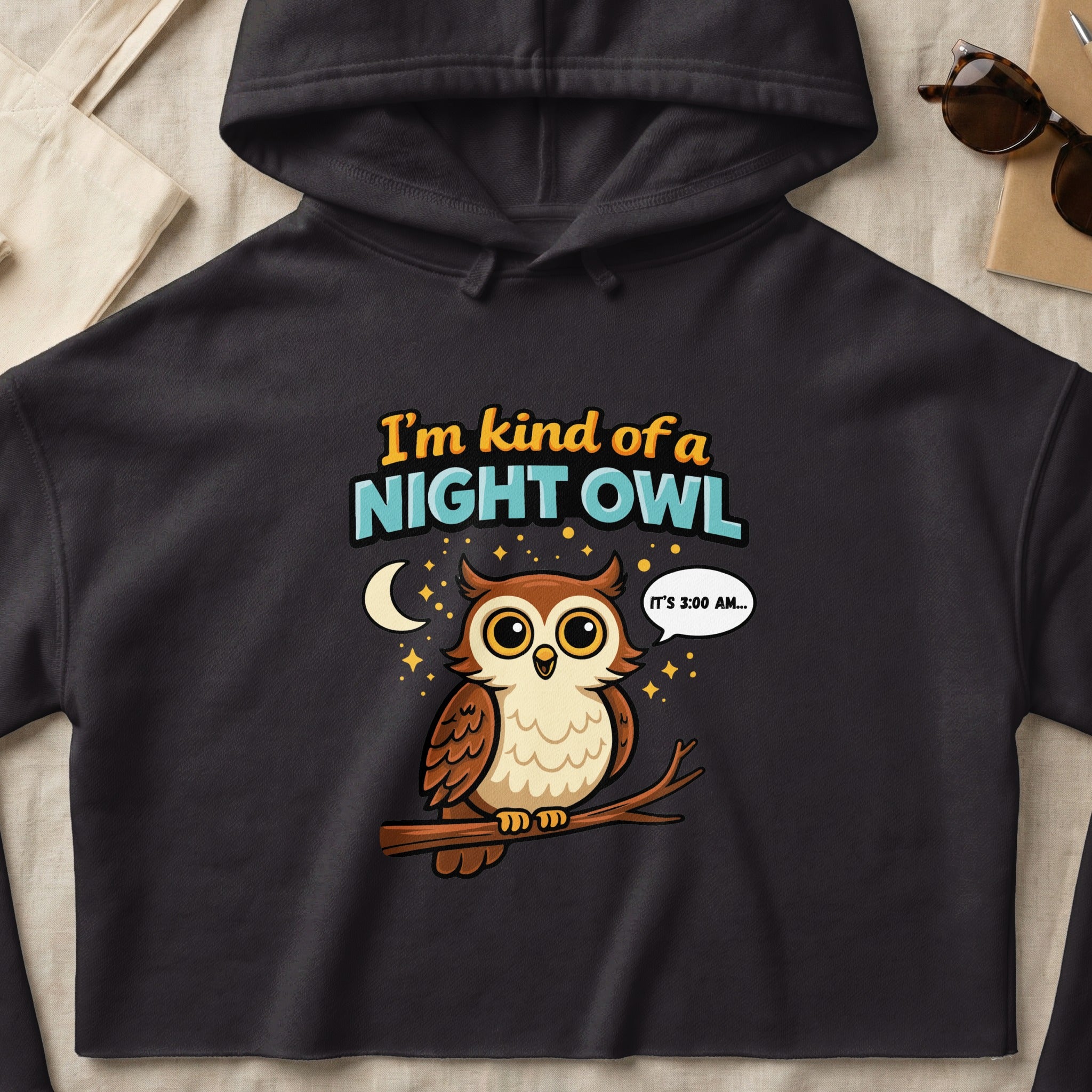 Black hoodie with a cartoon owl wearing glasses and text "I'm kind of a night owl".