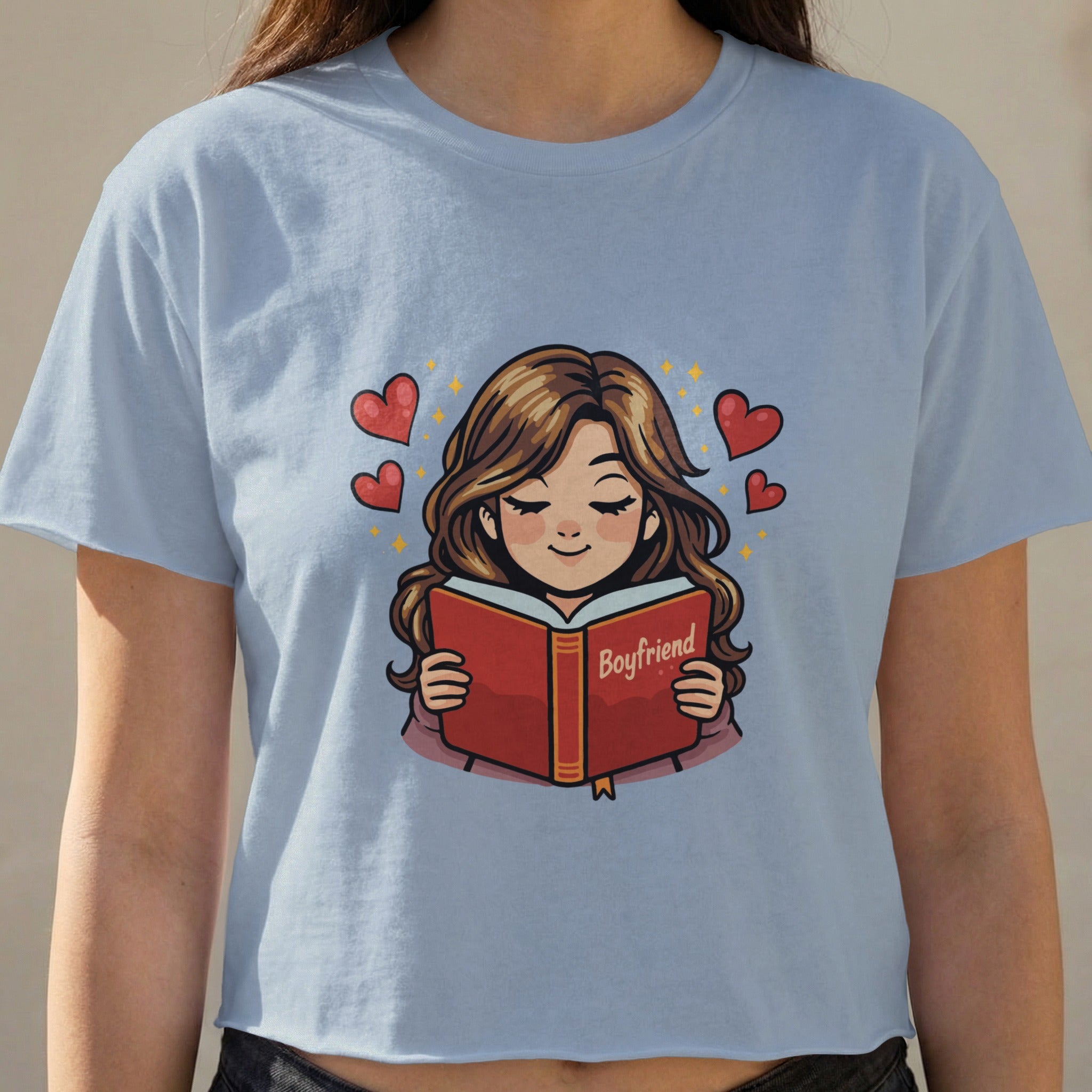 Cartoon girl wearing light blue shirt reads a book titled "Boyfriend".