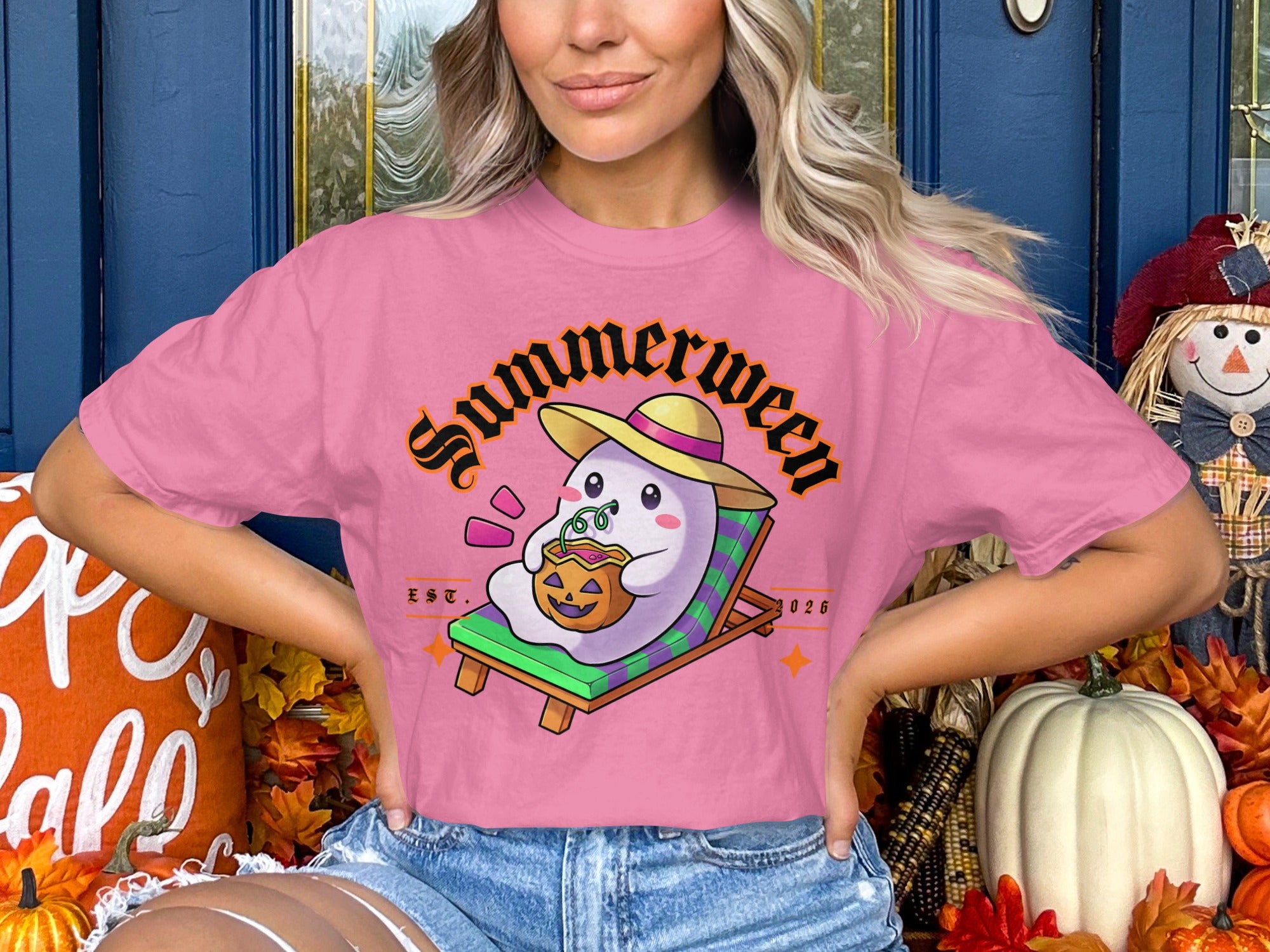 Pink t-shirt with "Summerween" text and a ghost on a beach chair drinking from a pumpkin.
